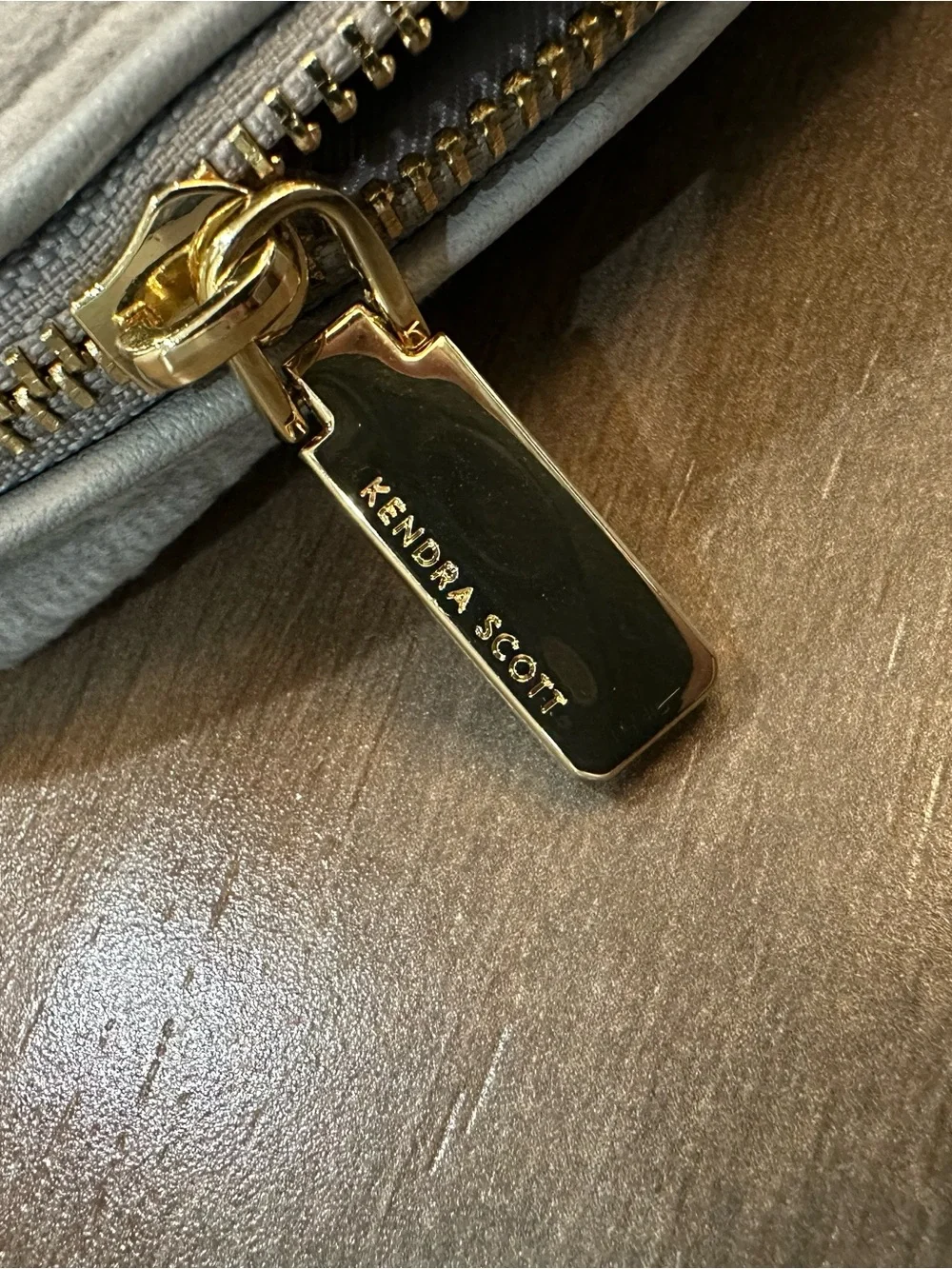 Kendra Scott Light Gray Logo Embossed Pouch with Gold Accent